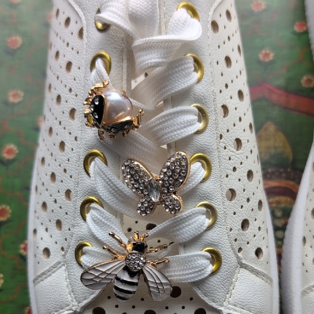 DV by Dolce Vita White Laser-Cut Sneakers with Gold Bee Charms - Picture 2 of 9